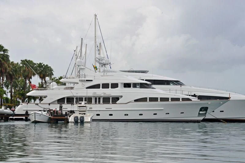 a white yacht in the water aboard CAMARINA ROYALE Yacht for Sale