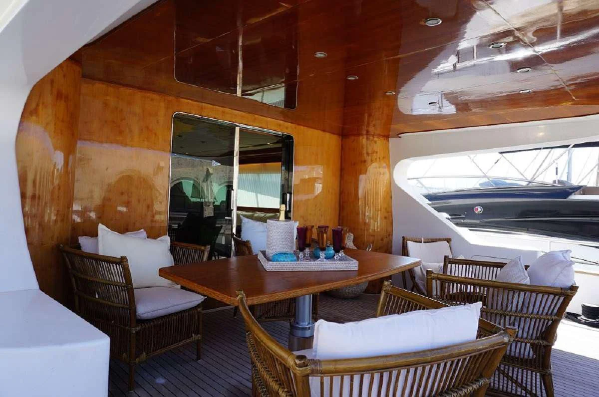 a table and chairs in a room aboard BALU 3 Yacht for Sale