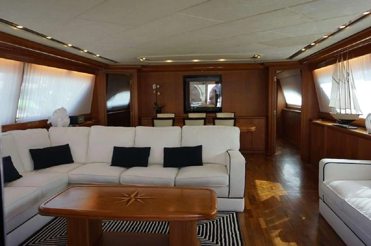 a living room with a couch and a table aboard BALU 3 Yacht for Sale