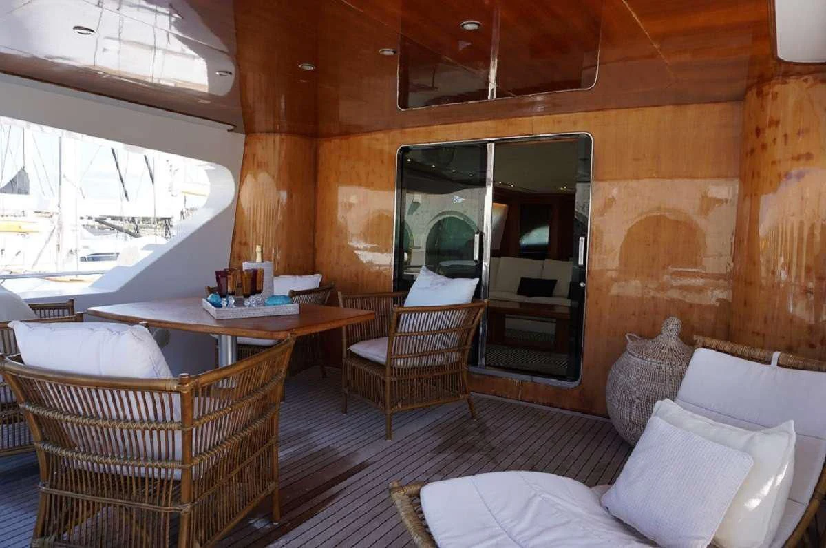 a living room with a couch and chairs aboard BALU 3 Yacht for Sale