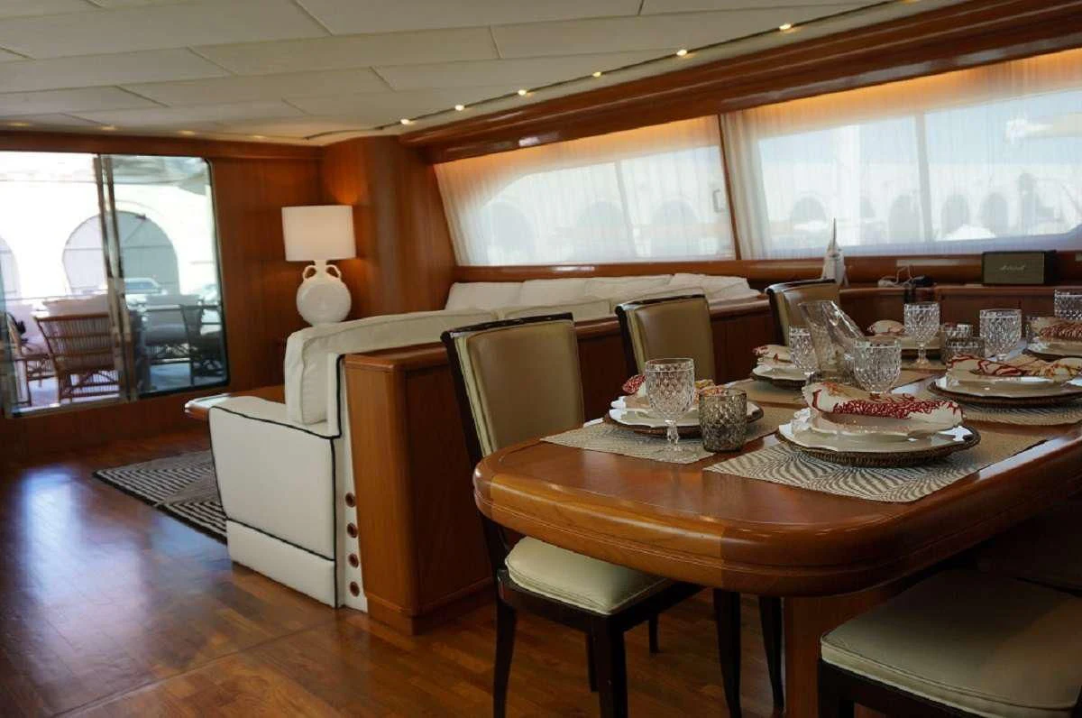 a dining room with a table and chairs aboard BALU 3 Yacht for Sale