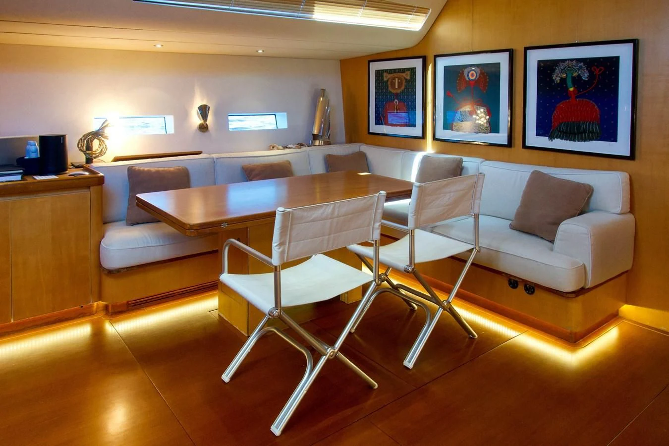 a room with a couch and a table aboard MAGIC BLUE Yacht for Sale
