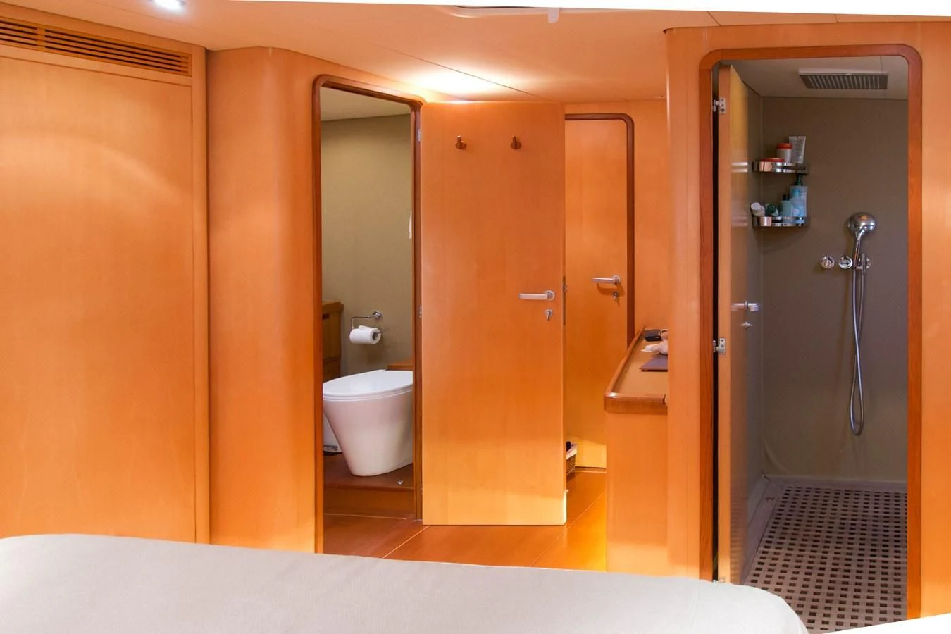 a bathroom with a toilet and shower aboard MAGIC BLUE Yacht for Sale