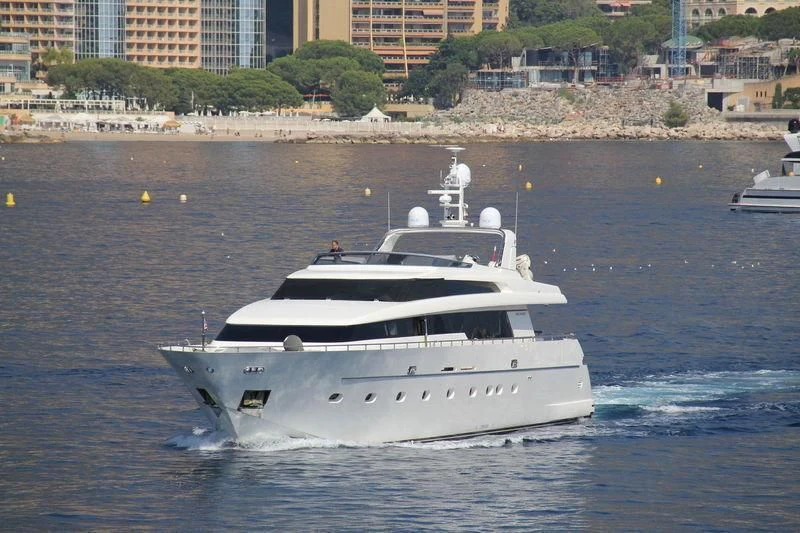 a white boat on the water aboard ALPHA PAPA Yacht for Sale