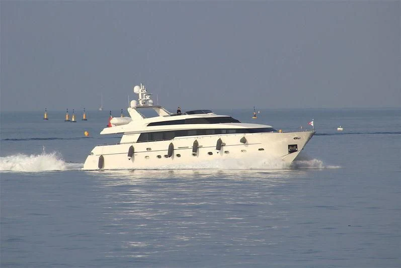 a white boat on the water aboard ALPHA PAPA Yacht for Sale