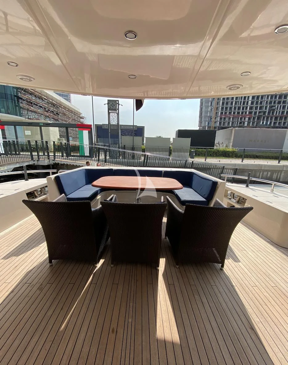 a table and chairs on a deck aboard SERDAL Yacht for Sale