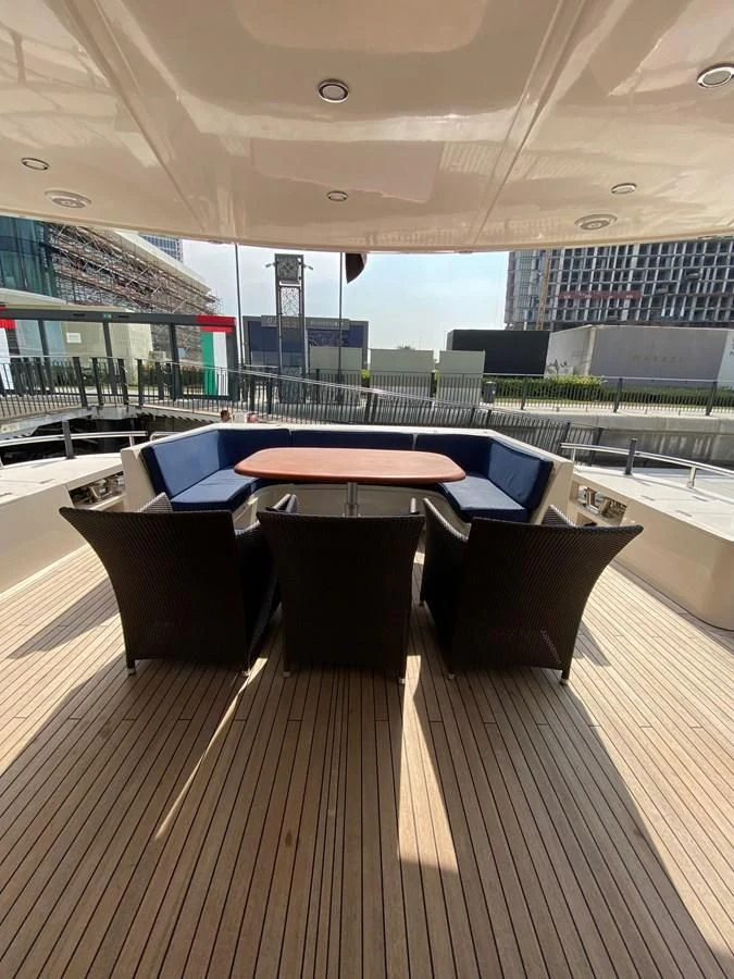 a table and chairs on a deck aboard SERDAL Yacht for Sale