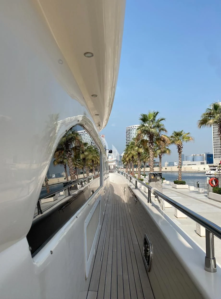 a white building with a balcony aboard SERDAL Yacht for Sale