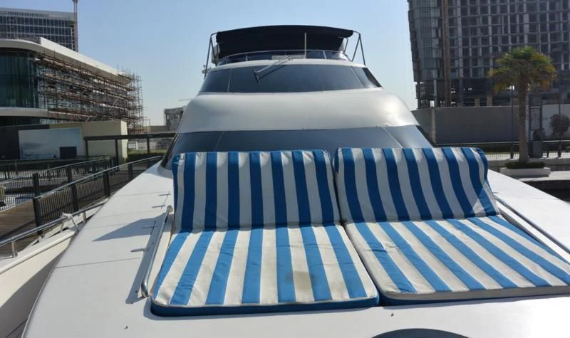 a white car with a striped roof aboard SERDAL Yacht for Sale