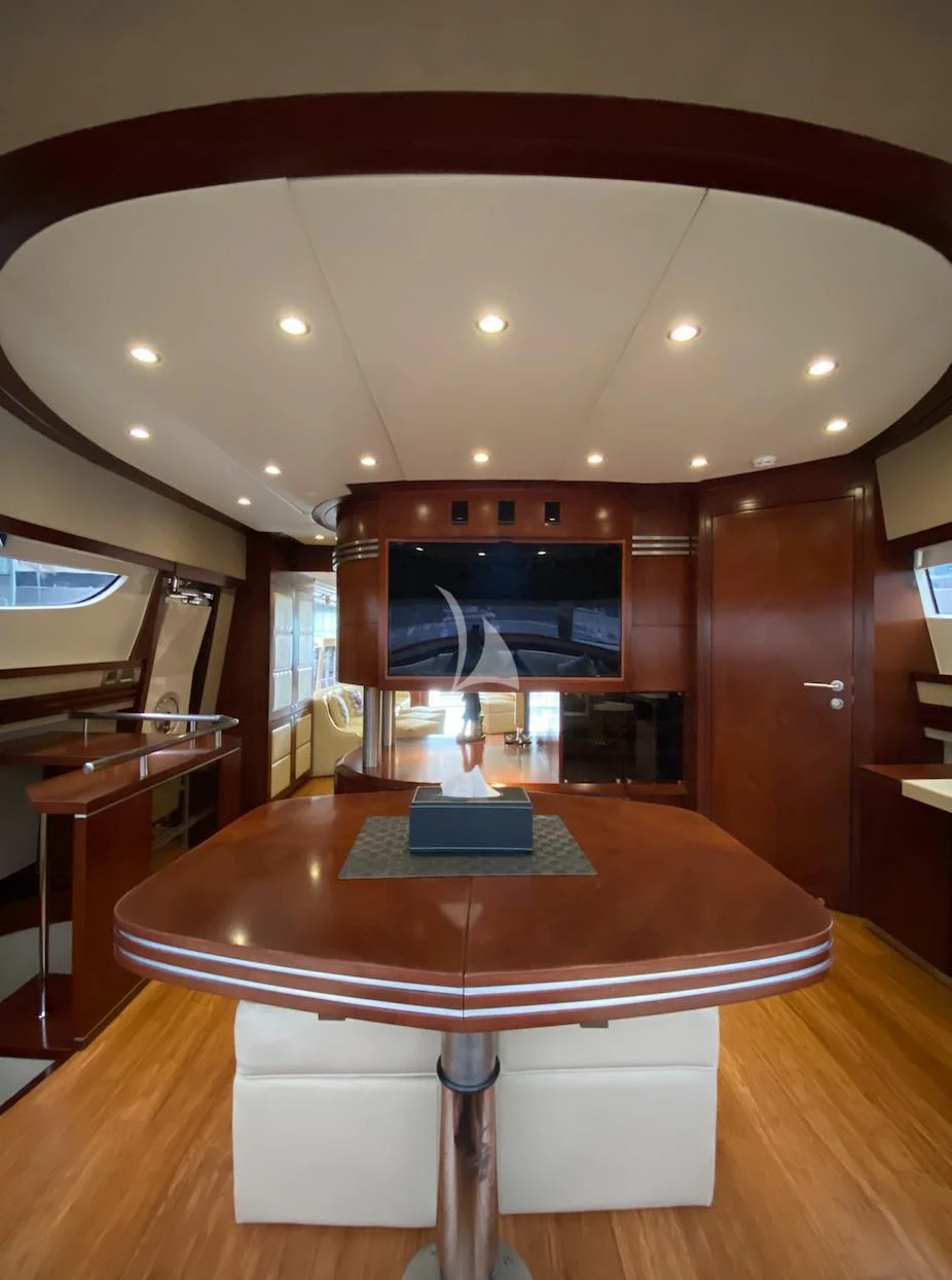 a table with a lamp on it aboard SERDAL Yacht for Sale