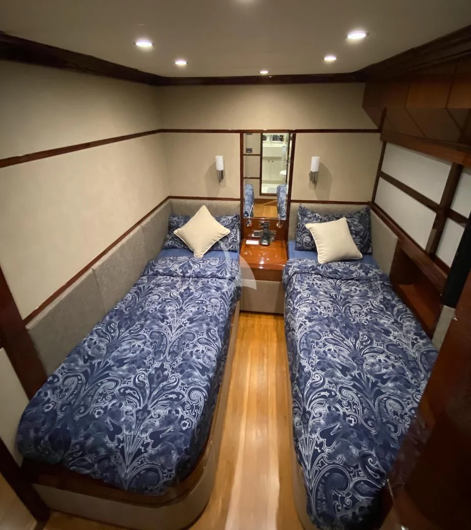 a room with a bed and a chair aboard SERDAL Yacht for Sale