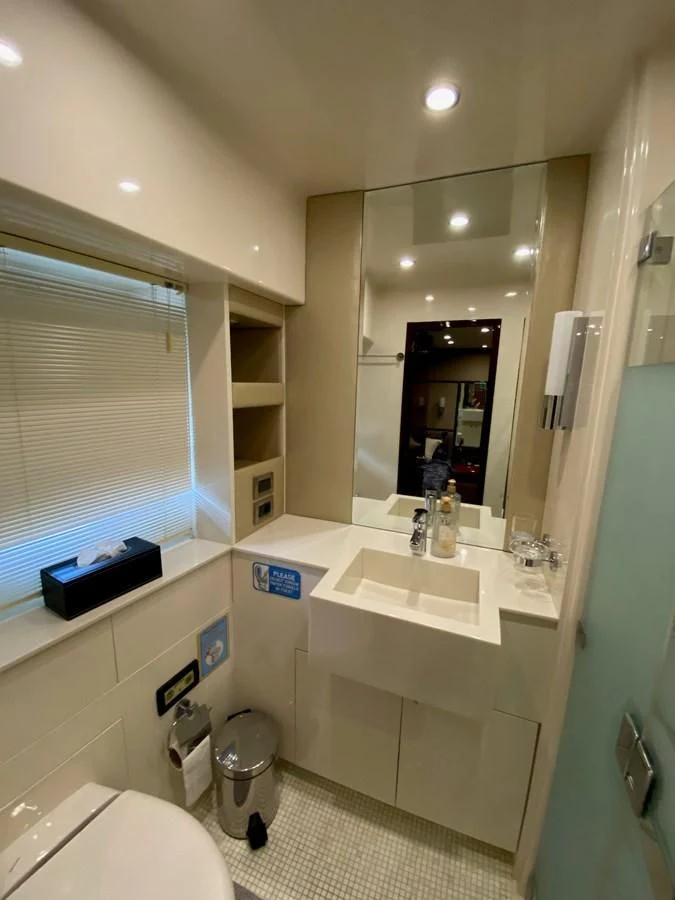 a bathroom with a sink and a mirror aboard SERDAL Yacht for Sale
