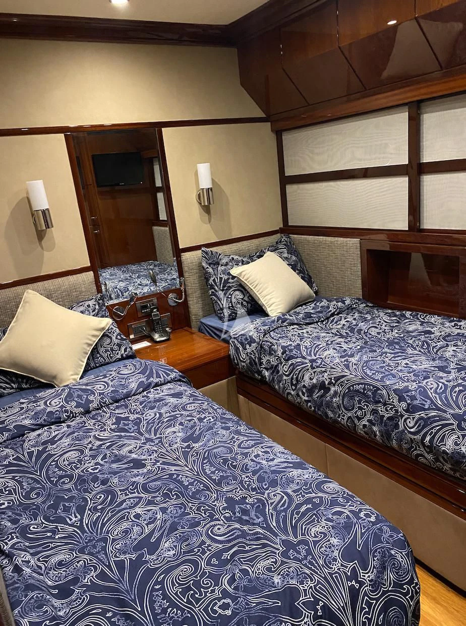 a couple of beds in a hotel room aboard SERDAL Yacht for Sale