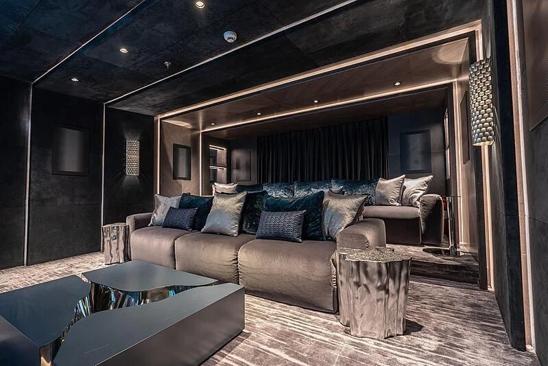 a living room with a large couch aboard TATIANA Yacht for Sale