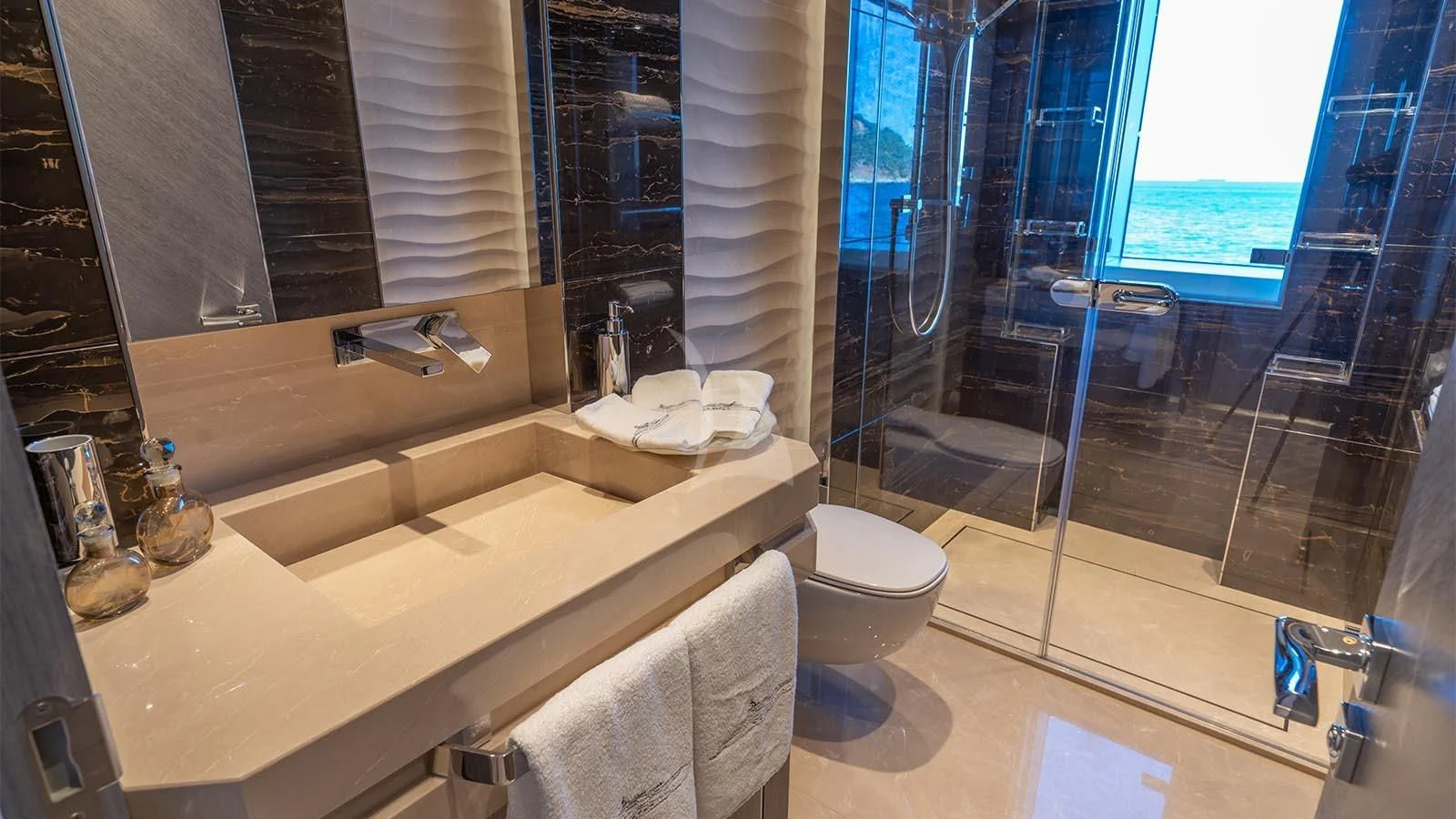a bathroom with a glass shower aboard TATIANA Yacht for Sale