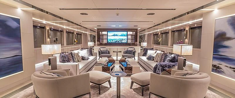 a living room with a large screen aboard TATIANA Yacht for Sale