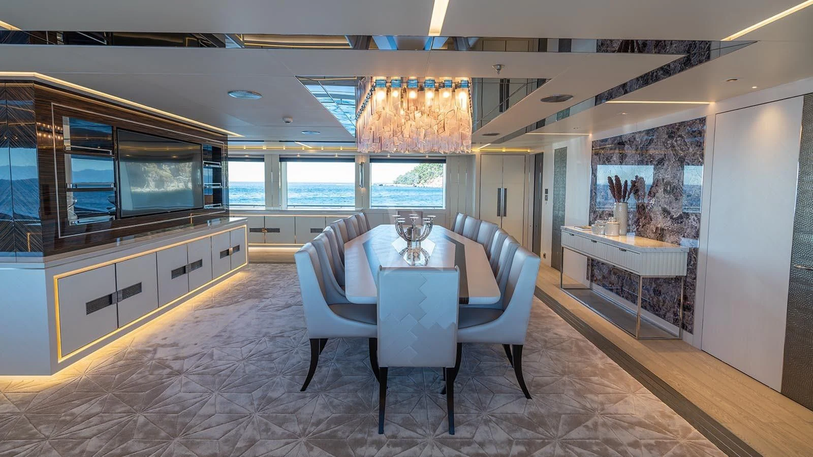 a large room with a table and chairs aboard TATIANA Yacht for Sale