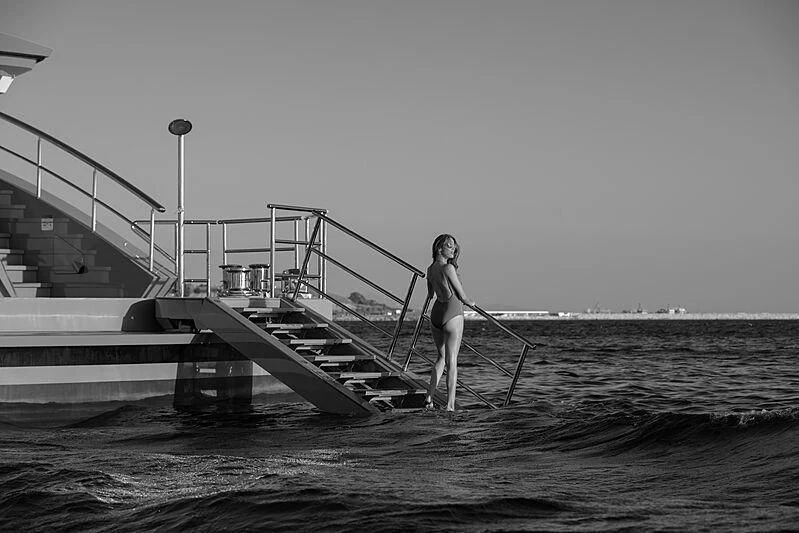 a person is standing on a dock aboard TATIANA Yacht for Sale