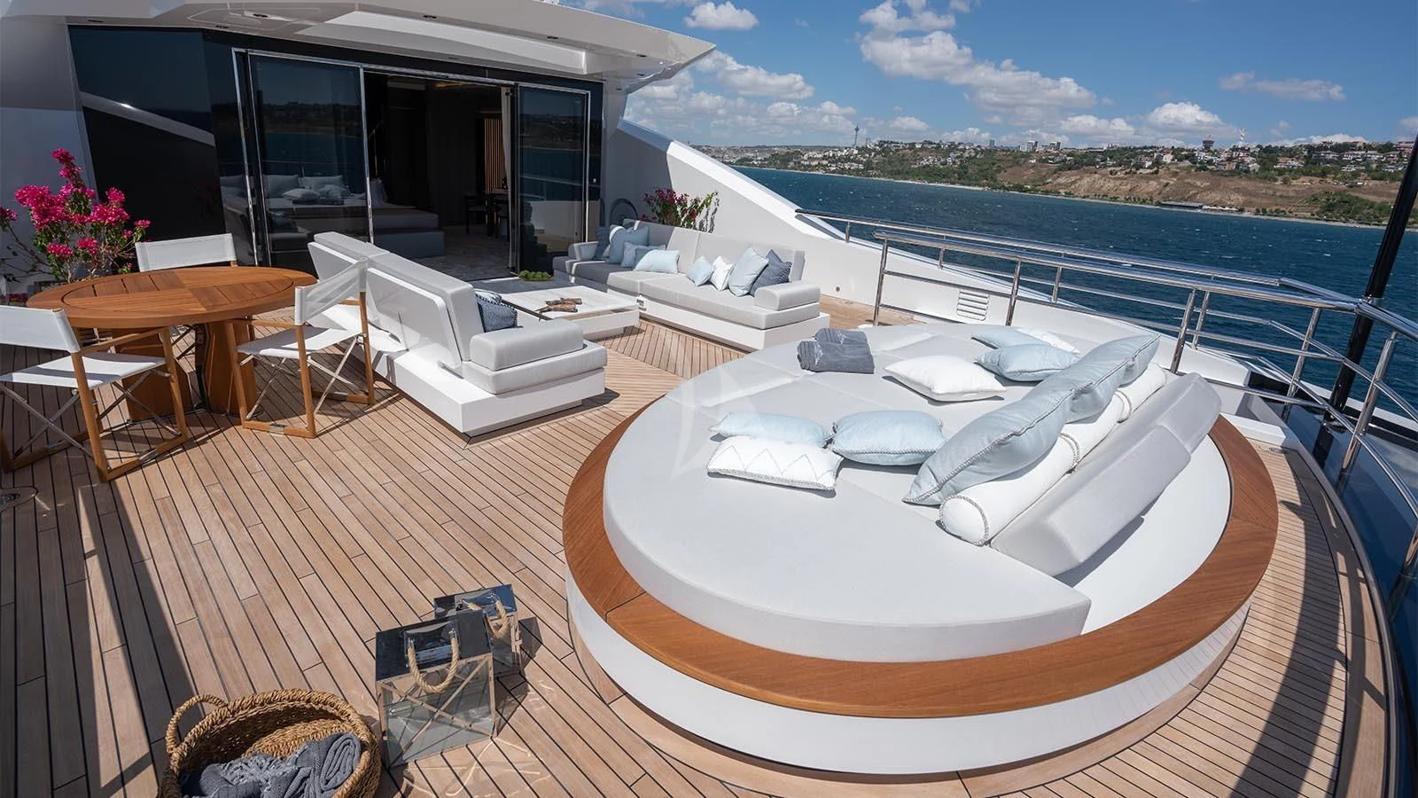 a large white bed on a deck aboard TATIANA Yacht for Sale