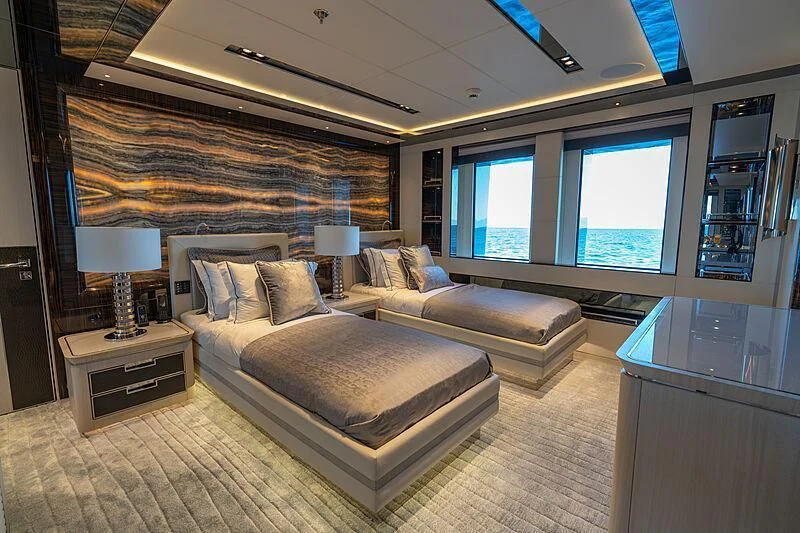 a large bedroom with a large bed aboard TATIANA Yacht for Sale