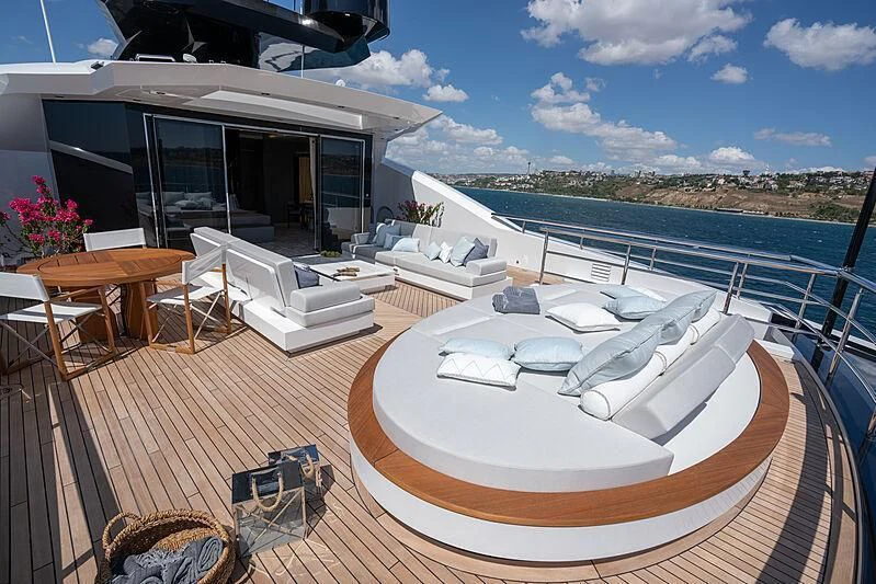 a large pool with a deck and lounge chairs aboard TATIANA Yacht for Sale