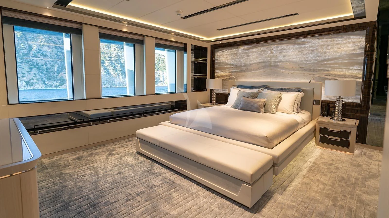 a large room with a bed and a tv aboard TATIANA Yacht for Sale