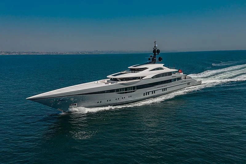 a large ship in the water aboard TATIANA Yacht for Sale