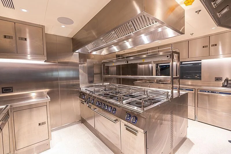a kitchen with stainless steel appliances aboard TATIANA Yacht for Sale