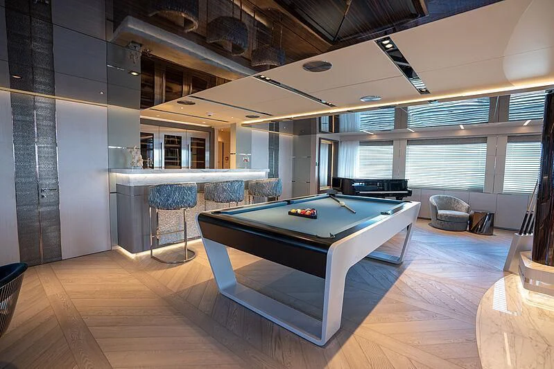 a large room with a pool table aboard TATIANA Yacht for Sale