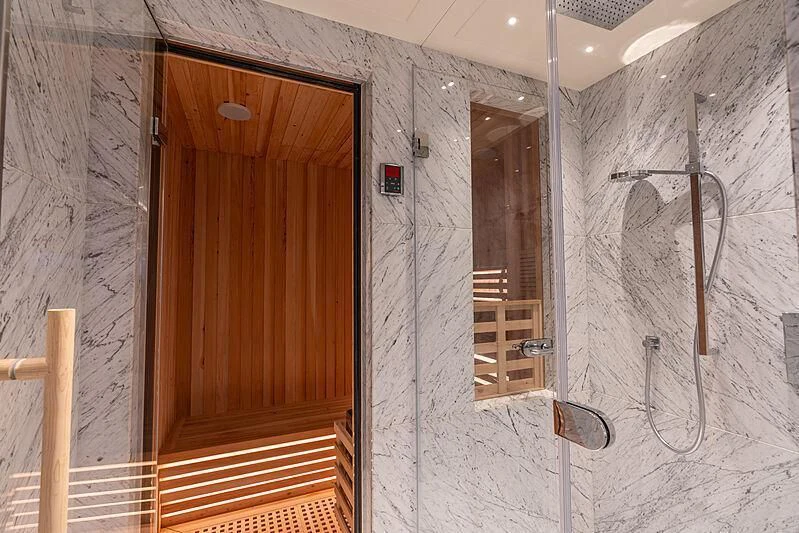 a room with a door and a mirror aboard TATIANA Yacht for Sale