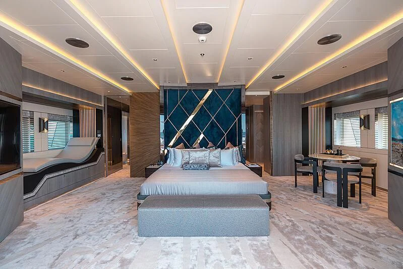 a large bedroom with a large bed aboard TATIANA Yacht for Sale