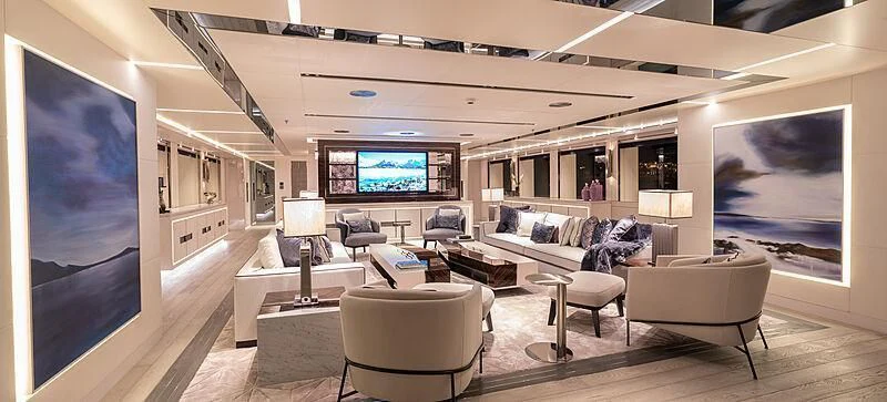 a living room with a large screen aboard TATIANA Yacht for Sale