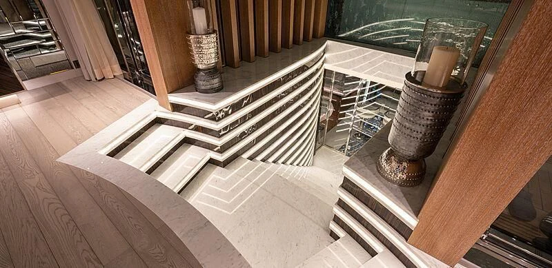 a room with a staircase and a glass window aboard TATIANA Yacht for Sale