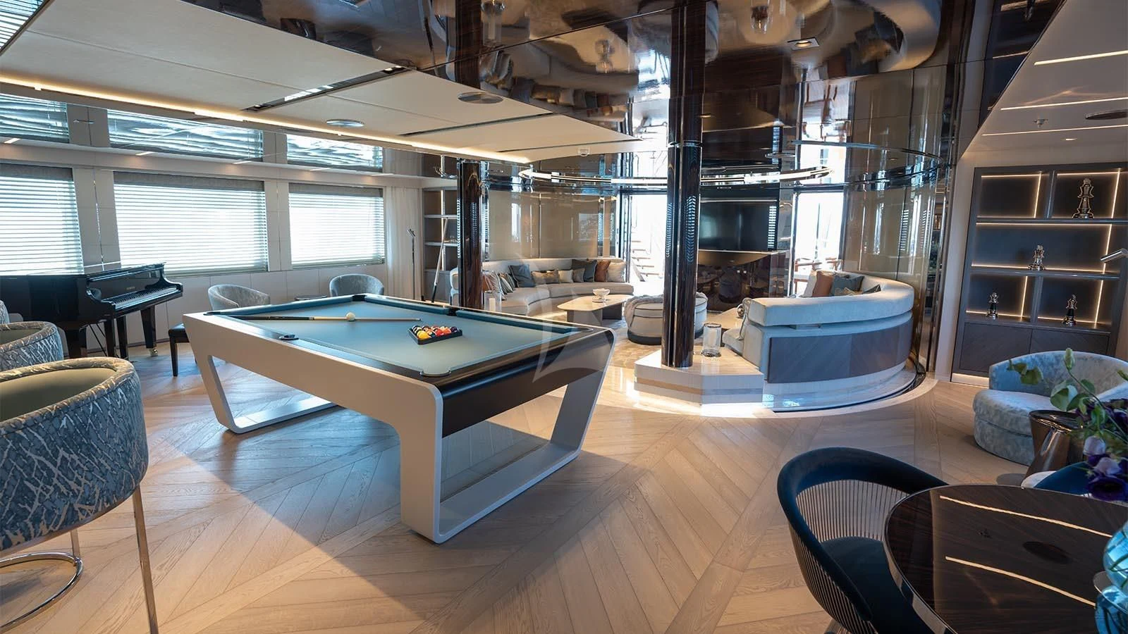 a room with a pool table and chairs aboard TATIANA Yacht for Sale
