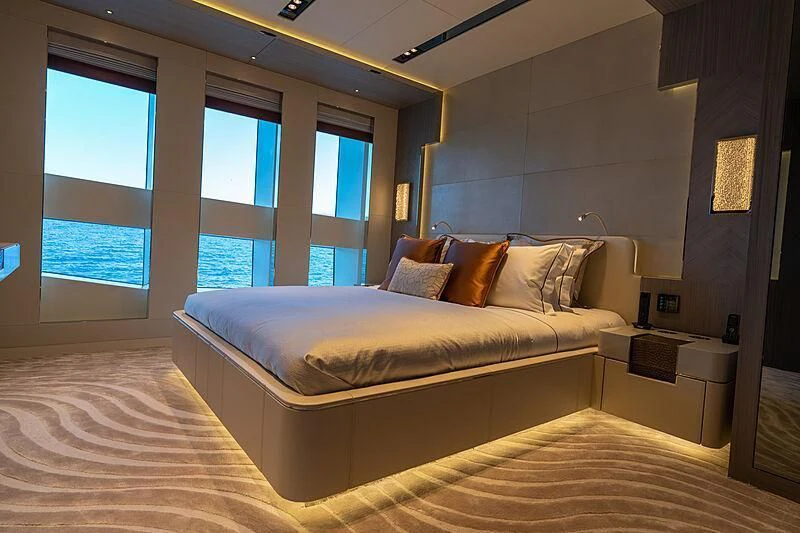 a bedroom with a large bed aboard TATIANA Yacht for Sale