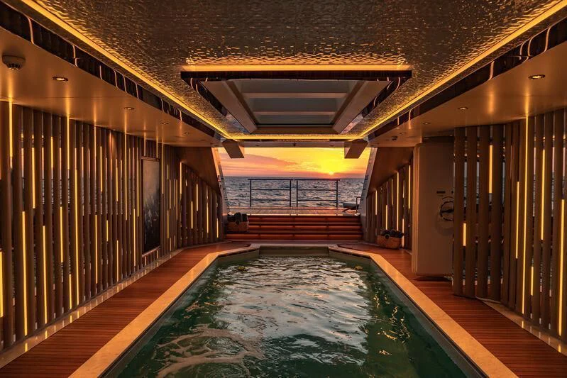a swimming pool in a building aboard TATIANA Yacht for Sale