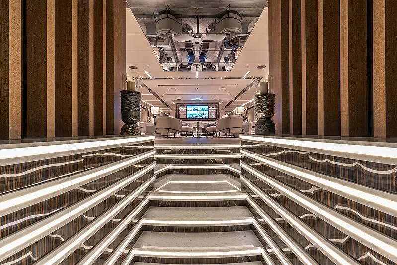 a large hall with stairs aboard TATIANA Yacht for Sale
