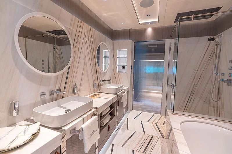 a bathroom with a sink and a mirror aboard TATIANA Yacht for Sale