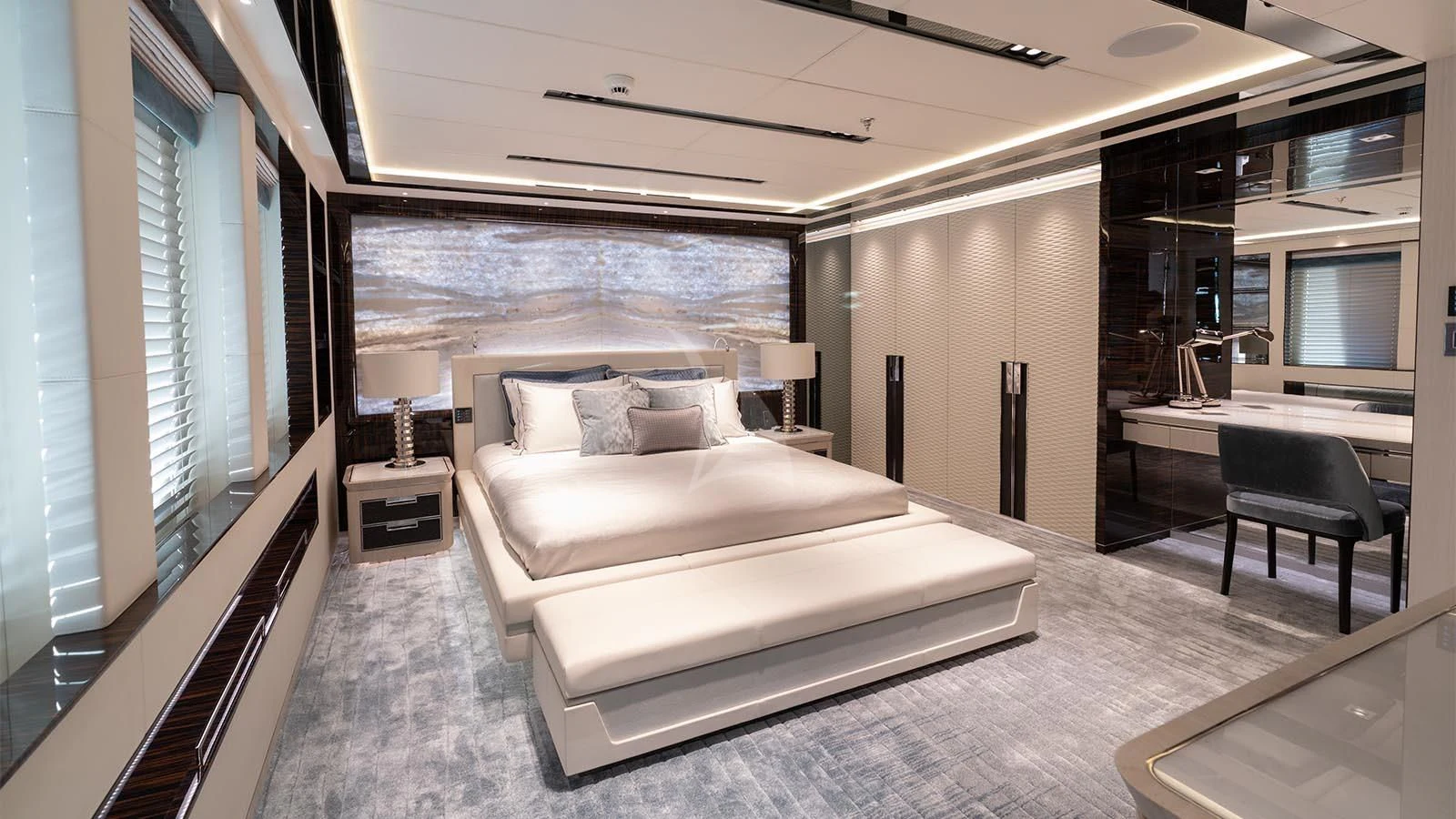 a large bedroom with a large bed aboard TATIANA Yacht for Sale