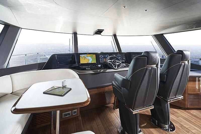 a room with a table and chairs aboard TATIANA Yacht for Sale