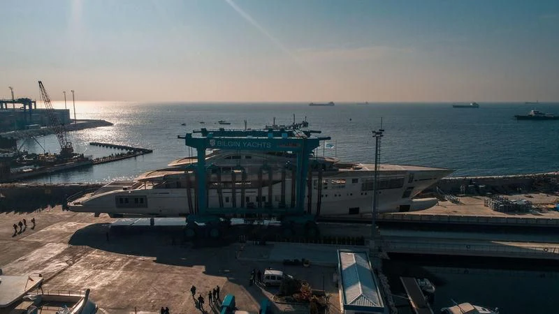 a large ship docked at a port aboard TATIANA Yacht for Sale