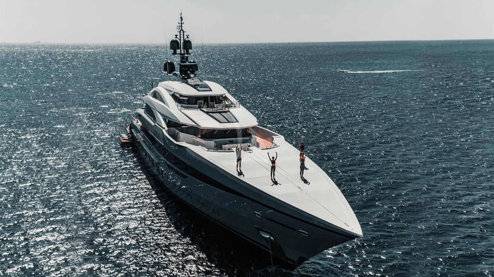 a large ship in the water aboard TATIANA Yacht for Sale