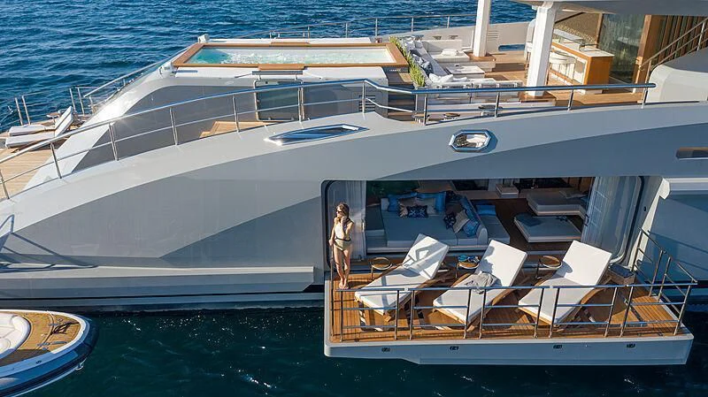 a large white boat with many seats aboard TATIANA Yacht for Sale
