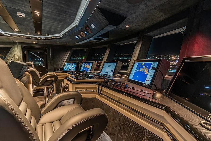 a room with a desk and chairs aboard TATIANA Yacht for Sale