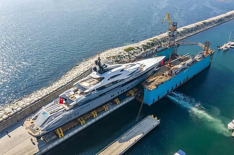 a large ship docked at a port aboard TATIANA Yacht for Sale