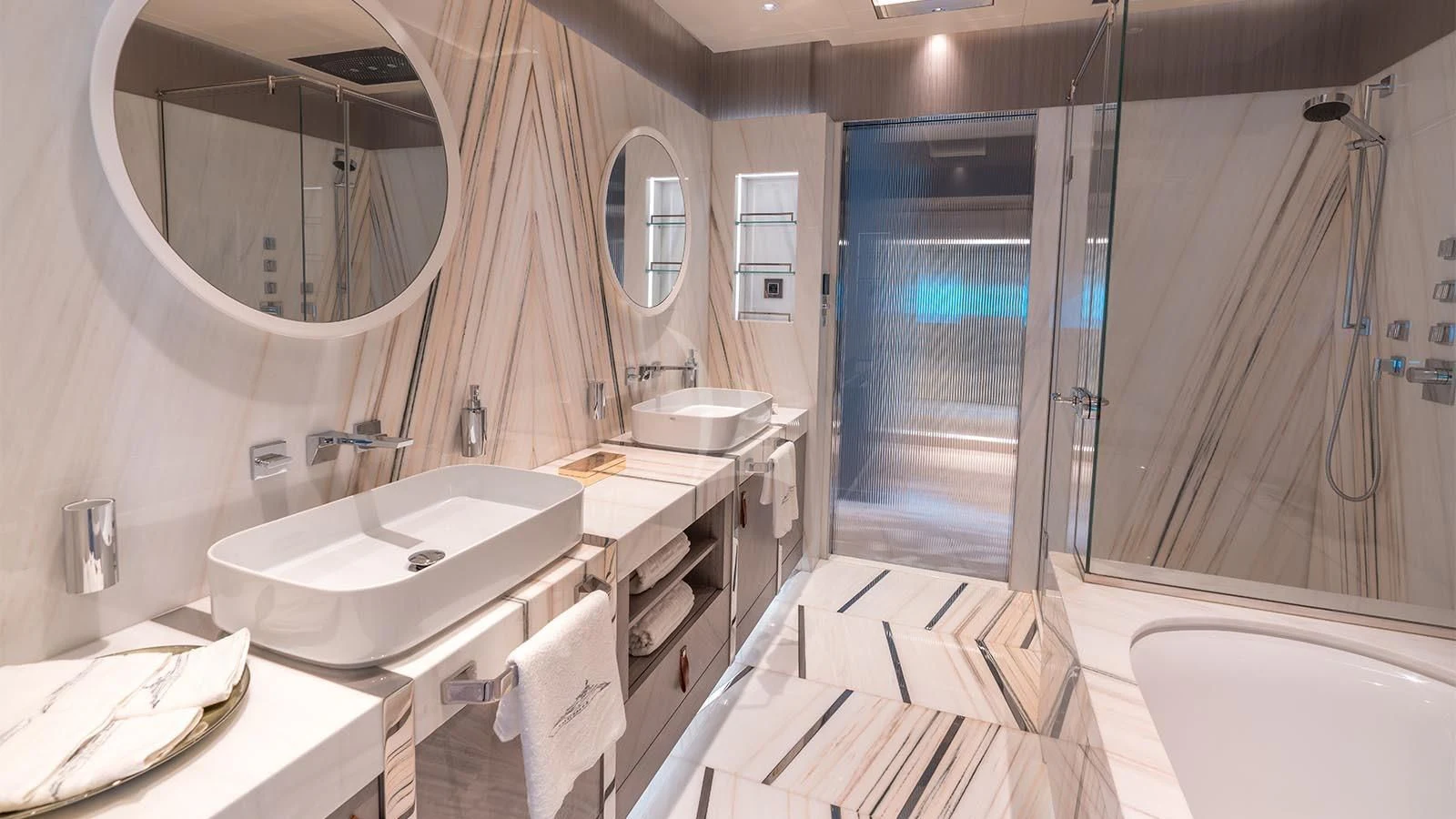 a bathroom with a sink and a bathtub aboard TATIANA Yacht for Sale