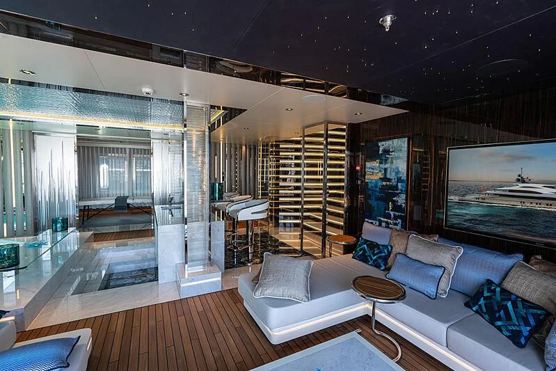 a living room with a large glass door aboard TATIANA Yacht for Sale