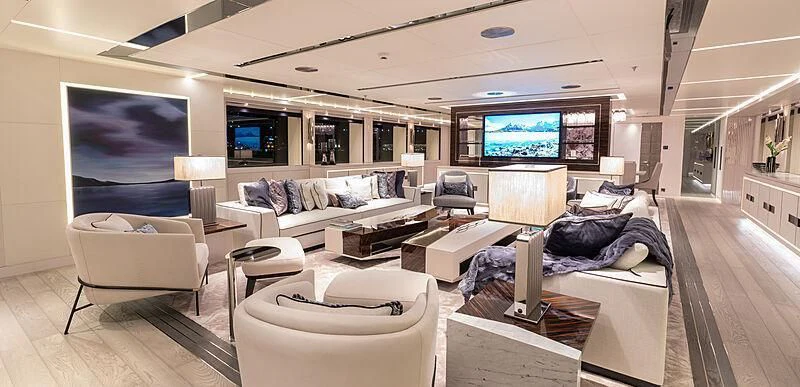 a living room with a large screen aboard TATIANA Yacht for Sale