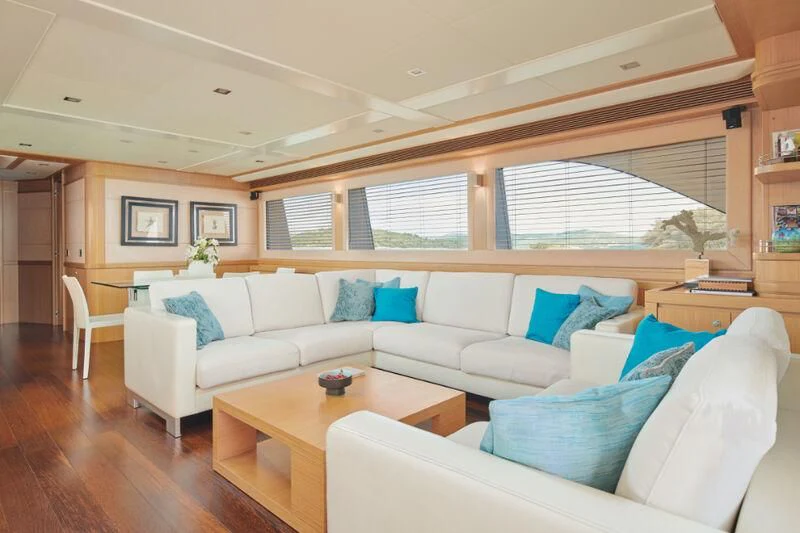 a living room with a couch and a table aboard FRIEND'S BOAT Yacht for Charter