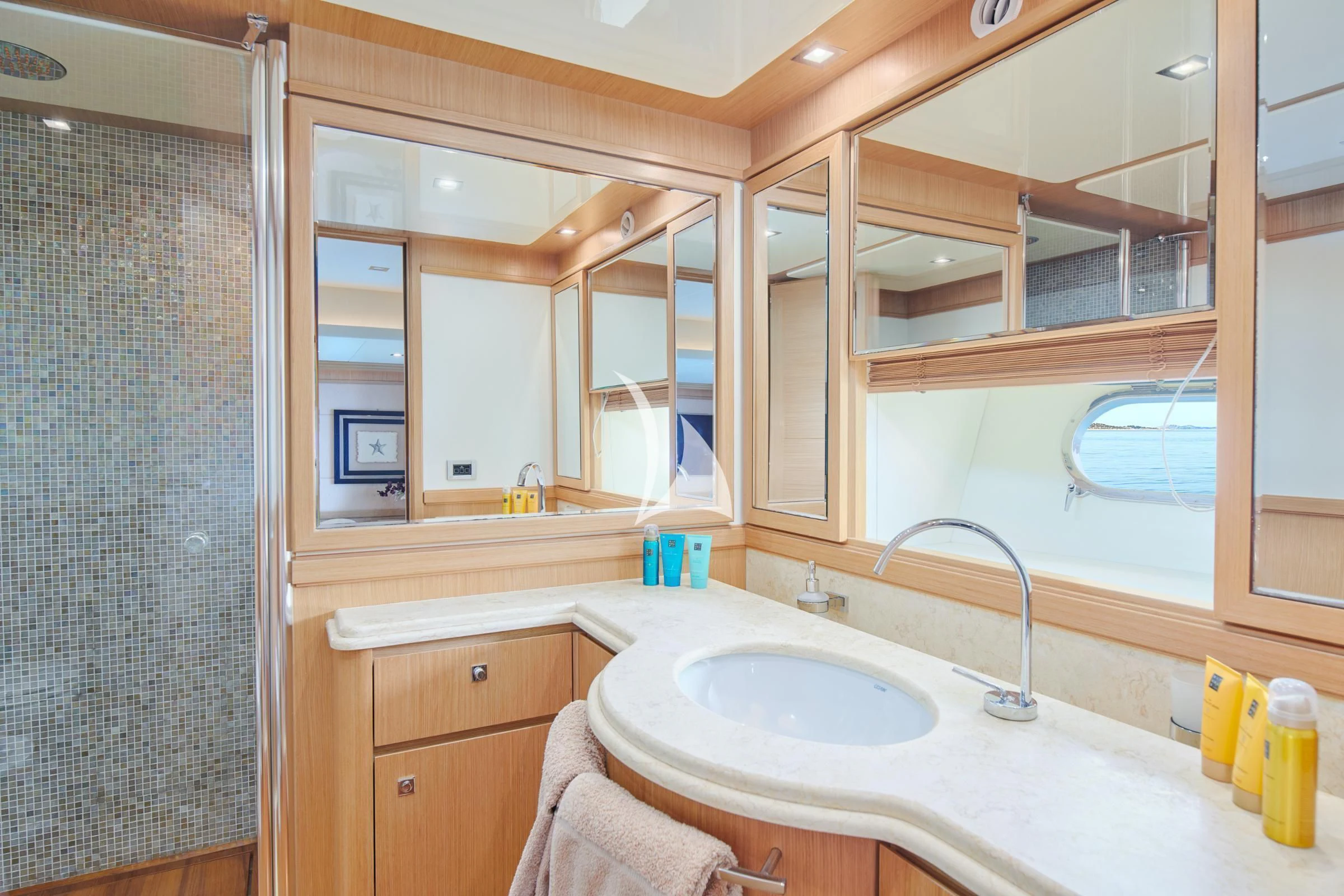 a bathroom with a sink and a mirror aboard FRIEND'S BOAT Yacht for Charter
